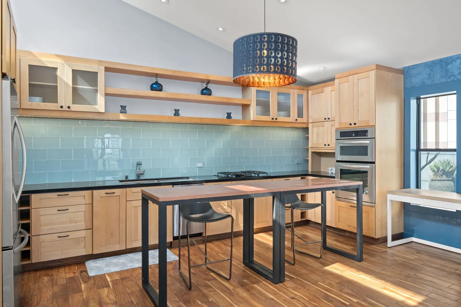 The penthouse kitchen, with its long table and stools