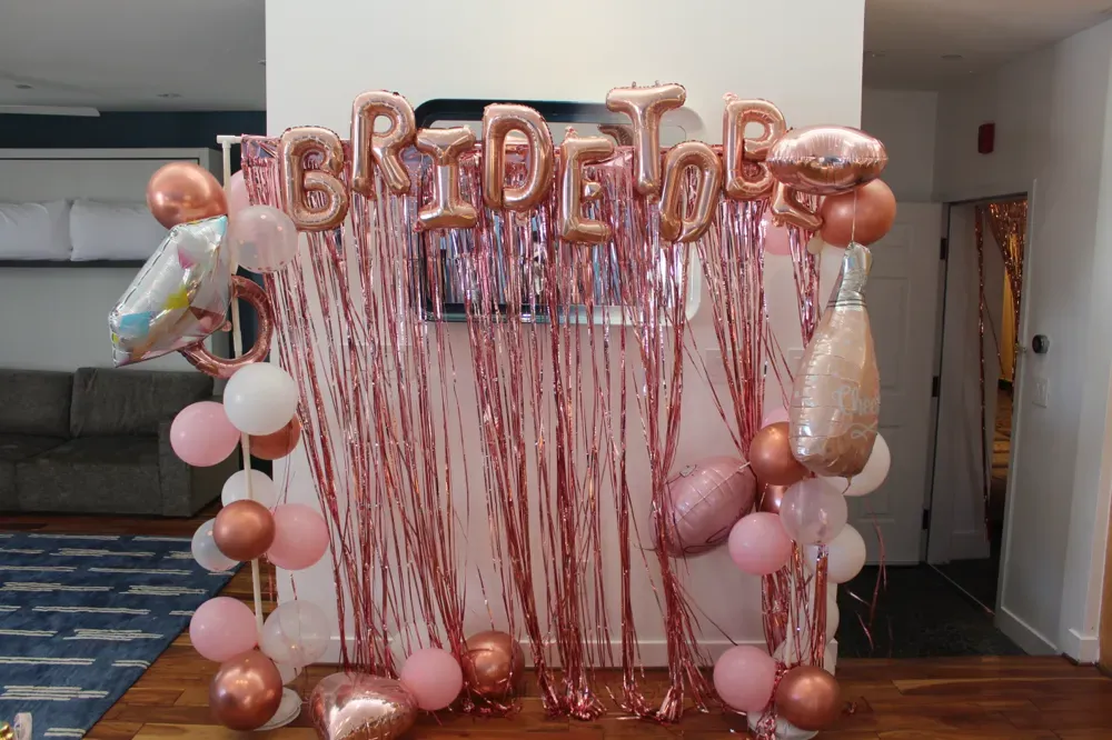 A bride-to-be balloon backdrop set up in the penthouse